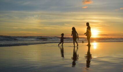 family on the beach in anna maria island